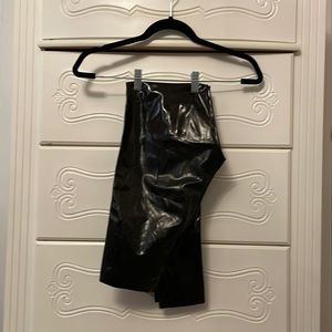 Commando high rise black patent leather leggings.